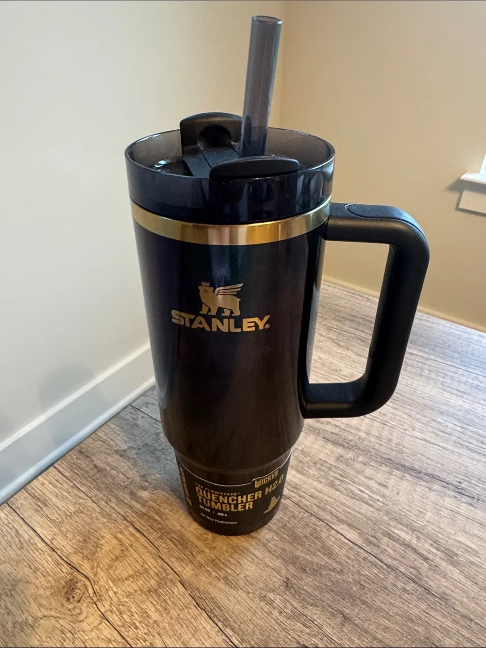 Stanley Black Travel Tumbler with Gold Accent and Handle